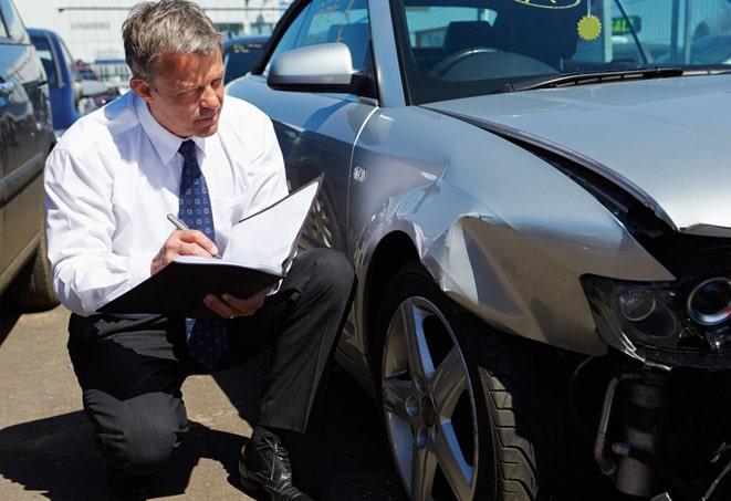 man discussing auto insurance options with agent